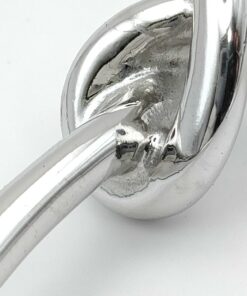 Underside view of central knot junction showing metal soldering joint