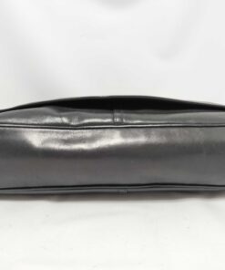 Bottom base panel of Coach black leather courier messenger bag.