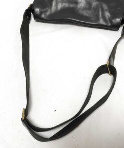 Full length of adjustable dark woven fabric webbing shoulder strap.