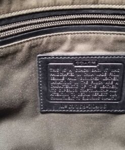 Interior leather creed patch debossed with Coach text and style number 70486.