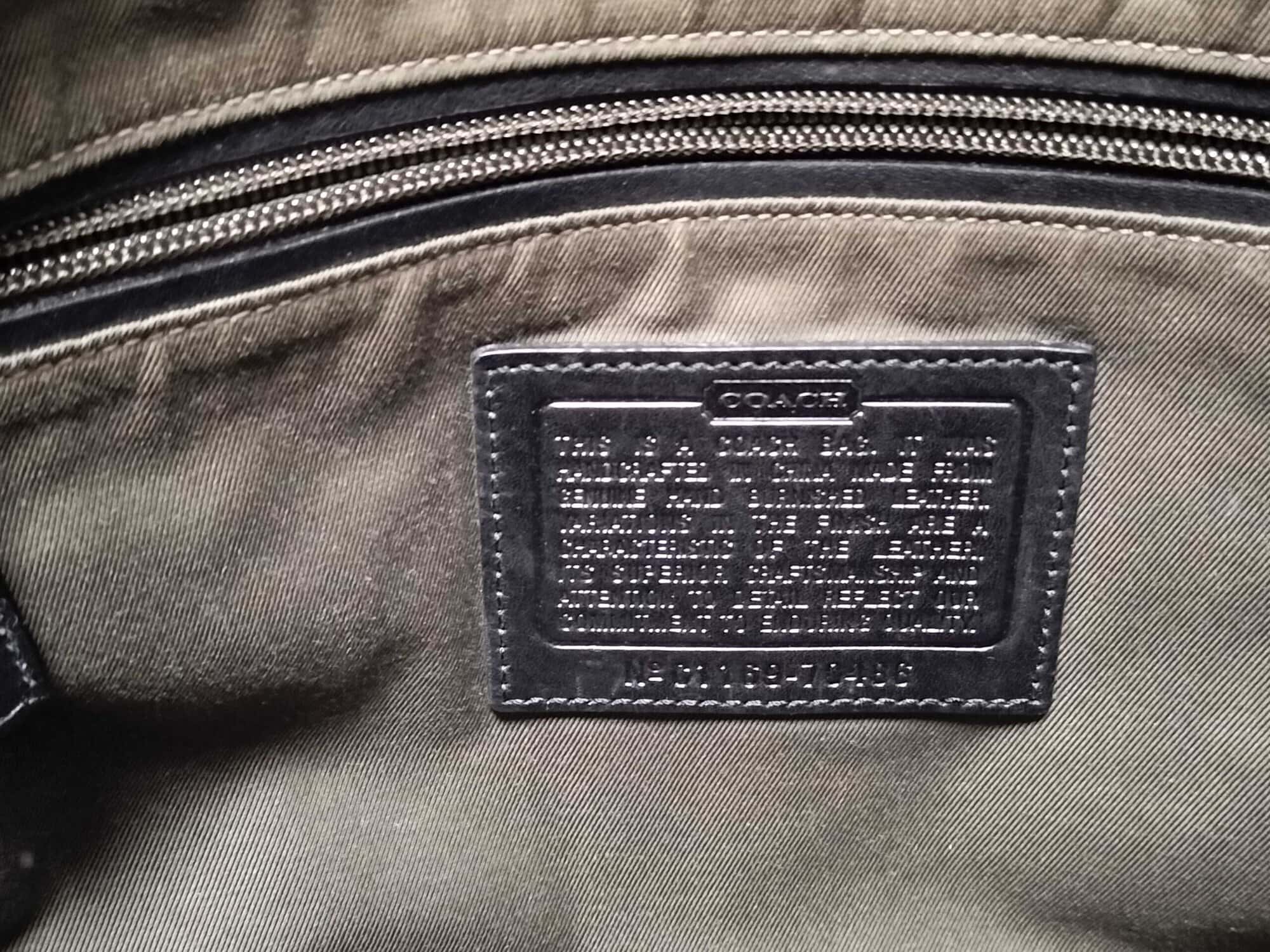 Interior leather creed patch debossed with Coach text and style number 70486.