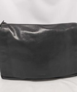 Front view of Coach Bleecker black leather courier messenger bag with flap closure.