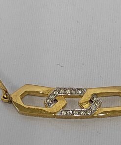 Givenchy gold-tone necklace featuring an interlocking hexagonal link motif with clear pavé accents on a flat chain.