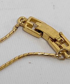Close-up of Givenchy gold-tone fold-over jewelry clasp