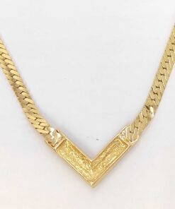 Textured reverse side of the Christian Dior gold-tone chevron station.