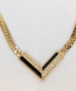Christian Dior gold-tone chevron station necklace with black accents and clear stones.