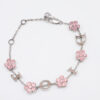 Christian Dior silver-tone charm bracelet arranged in an oval featuring pink floral stations and D-I-O-R letter charms.