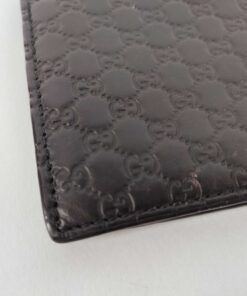 Macro close-up of Gucci Microguccissima embossed pattern and perimeter corner stitching
