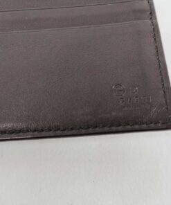 Close-up of debossed interior Gucci Made in Italy brand hallmark on black leather