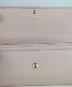Open front flap displaying the interior snap closure and gold Salvatore Ferragamo heat stamp.