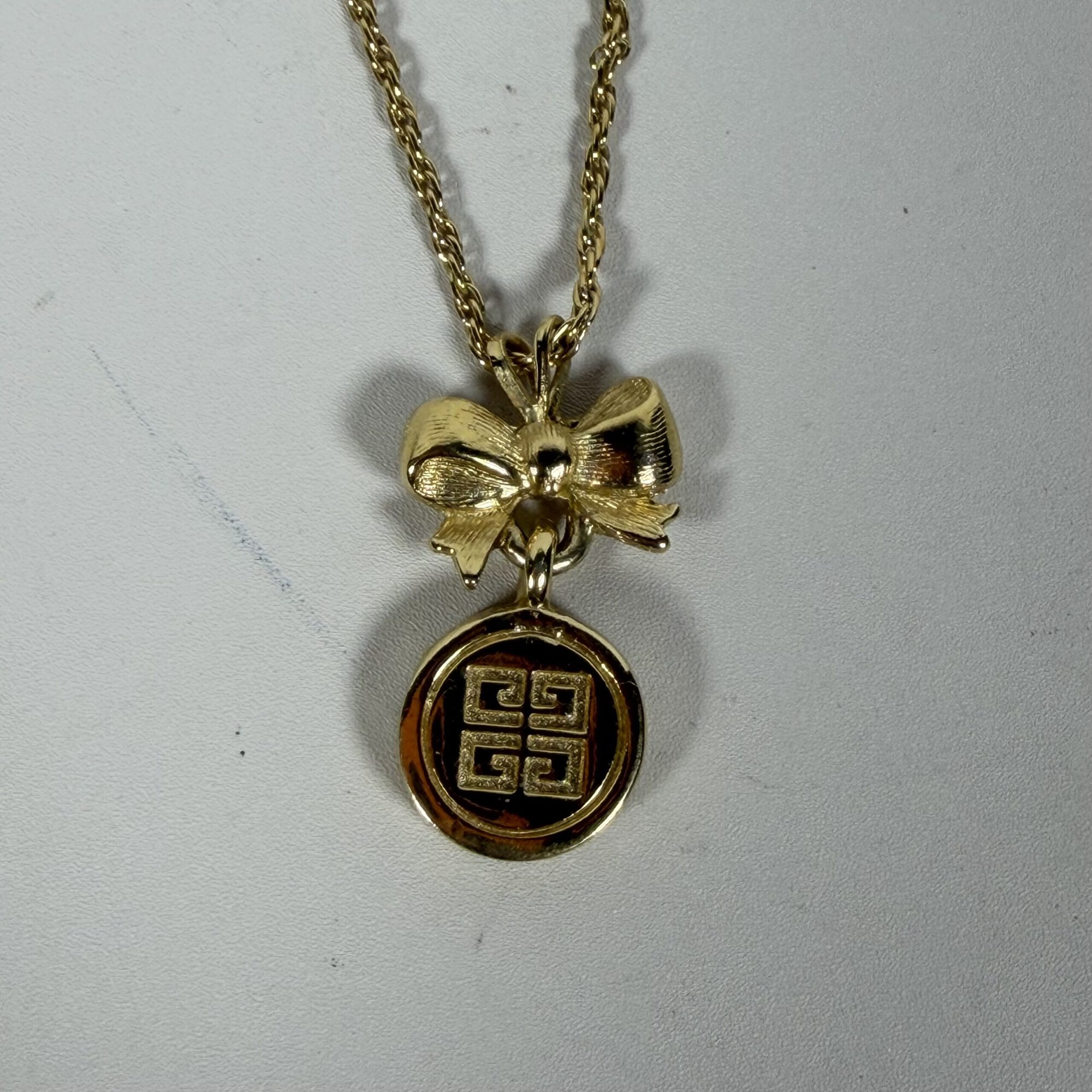 Vintage Givenchy Gold Tone Bow & 4G Logo Circle Pendant Necklace