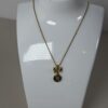 Vintage Givenchy Gold Tone Bow & 4G Logo Circle Pendant Necklace