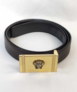 Versace dark brown leather belt coiled with gold-tone Medusa plaque buckle.