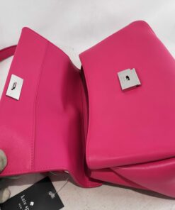 Open front flap displaying silver-tone push-lock hardware and interior opening