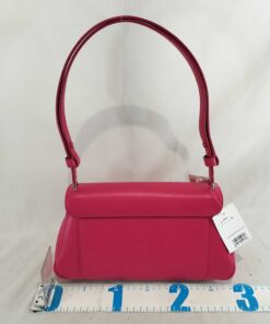 Rear panel of Kate Spade Grace bag showing slip pocket and measuring ruler