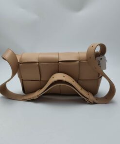 Rear view of Bottega Veneta Mini Cassette bag with folded adjustable shoulder strap.