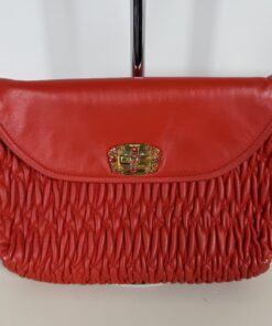 Front view of Miu Miu red gathered leather bag showing crystal turn-lock flap
