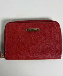 Burberry red grained leather zip-around coin purse front view with gold-tone logo plaque