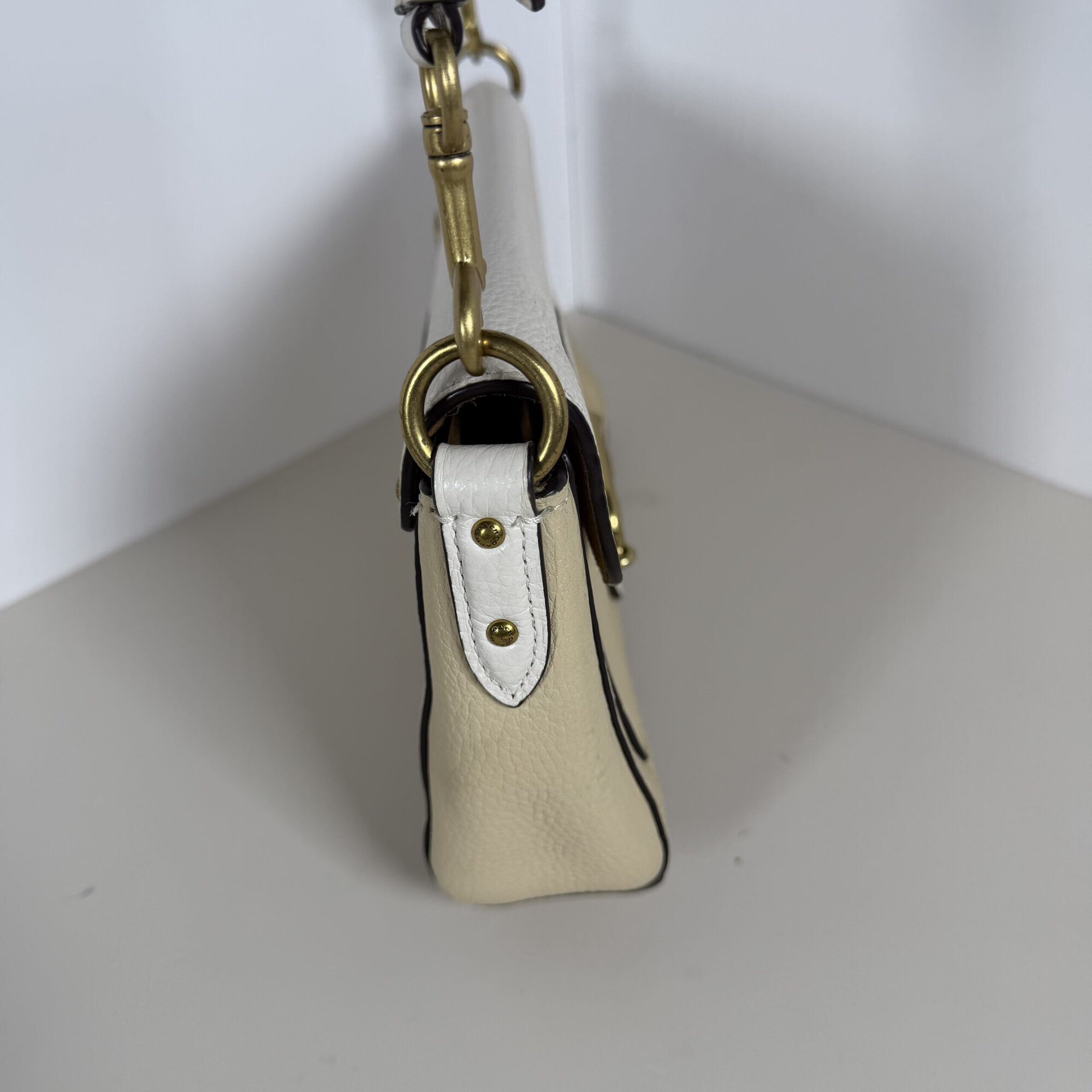 Opposite side profile of Coach Jade bag displaying leather side panel and edge paint