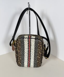 Burberry Monogram Stripe crossbody bag shown from a three-quarter angle on stand