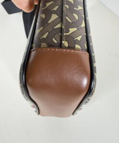 Close-up of smooth brown leather bottom base corner opposite side