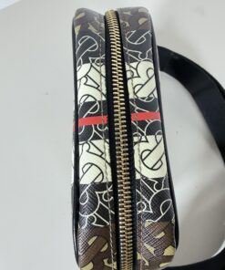Top view of Burberry crossbody bag showing zipper closure and striped canvas