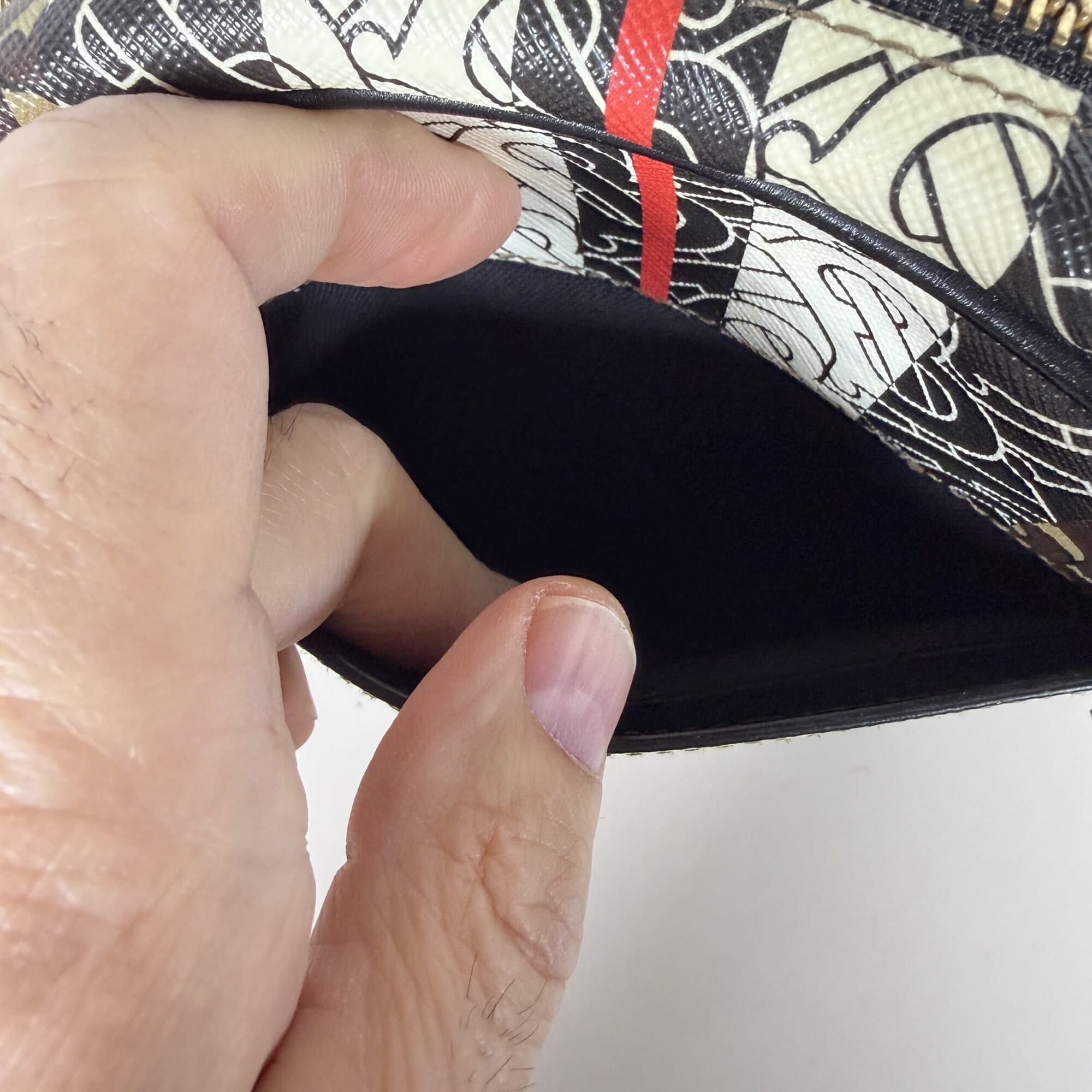Interior view of exterior slip pocket on Burberry crossbody bag