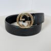 Gucci Guccissima leather belt coiled showing gold-tone Interlocking G buckle
