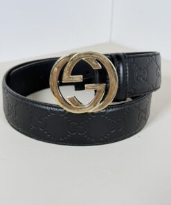 Gucci Guccissima leather belt coiled showing gold-tone Interlocking G buckle