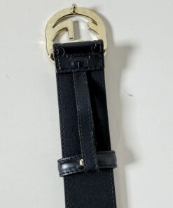 Reverse side of gold-tone Interlocking G buckle and leather retaining loop