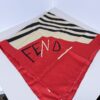 Fendi silk foulard scarf folded showing red corner with stylized script logo and black chevron stripes.