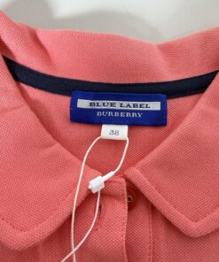 Close-up of woven Blue Label Burberry neck label and size 38 tag