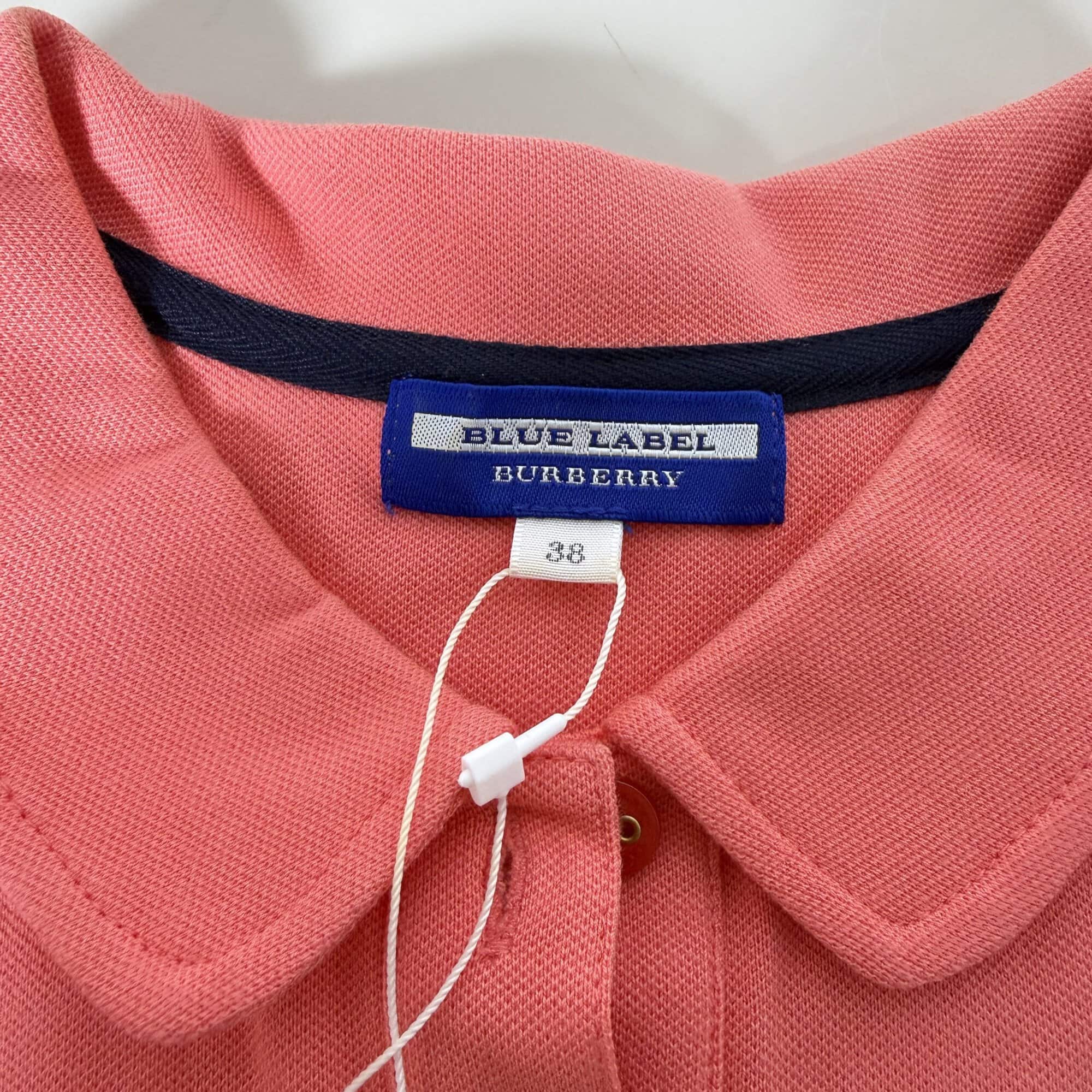 Close-up of woven Blue Label Burberry neck label and size 38 tag