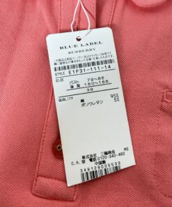 Attached Burberry Blue Label paper retail tag showing style code, size 38, and fabric content