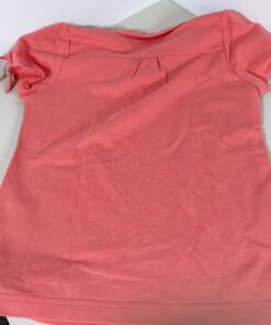 Back view of coral Burberry polo shirt showing gathered back yoke and sleeve ties