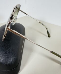 Side view of Ferragamo aviator sunglasses highlighting crystal accents along the brow and rim