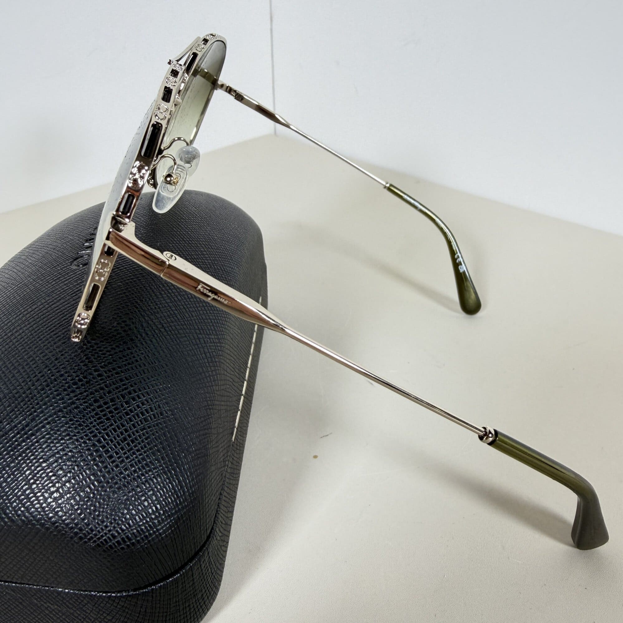Side view of Ferragamo aviator sunglasses highlighting crystal accents along the brow and rim